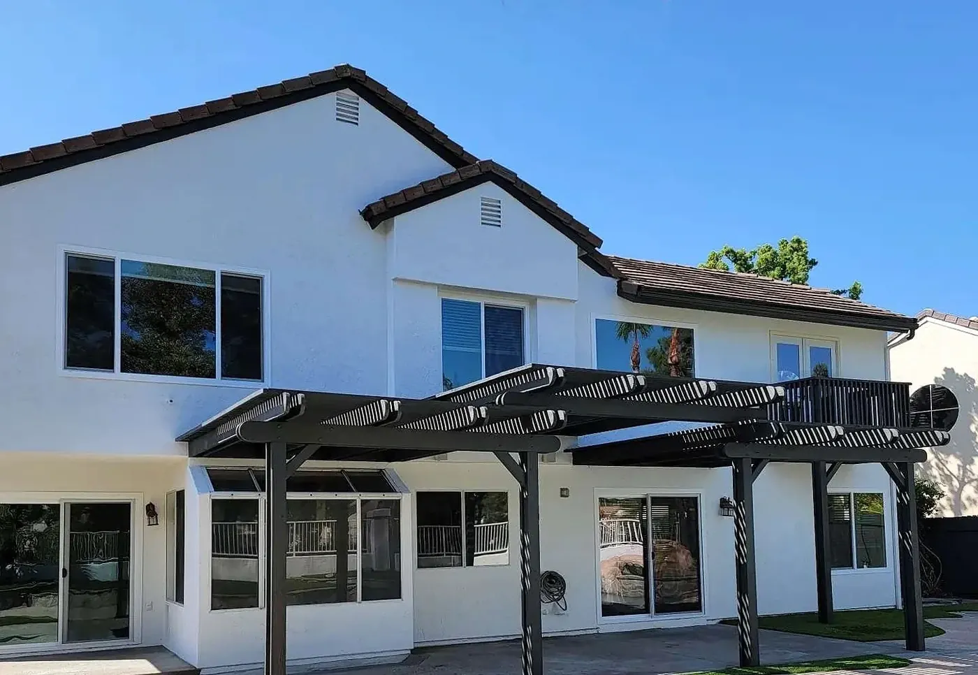 Completed BQ Painting exterior project showing finished home and roofline